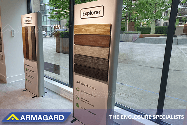 Two dual sided digital signage advertising totems for a flooring showroom