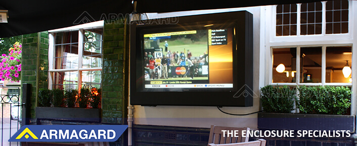 Wall-mounted outdoor TV enclosure in a restaurant