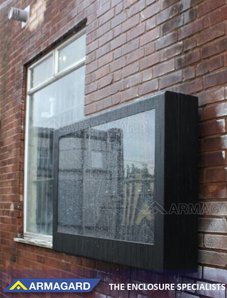 Waterproof outdoor TV enclosure fixed on the wall in the open air